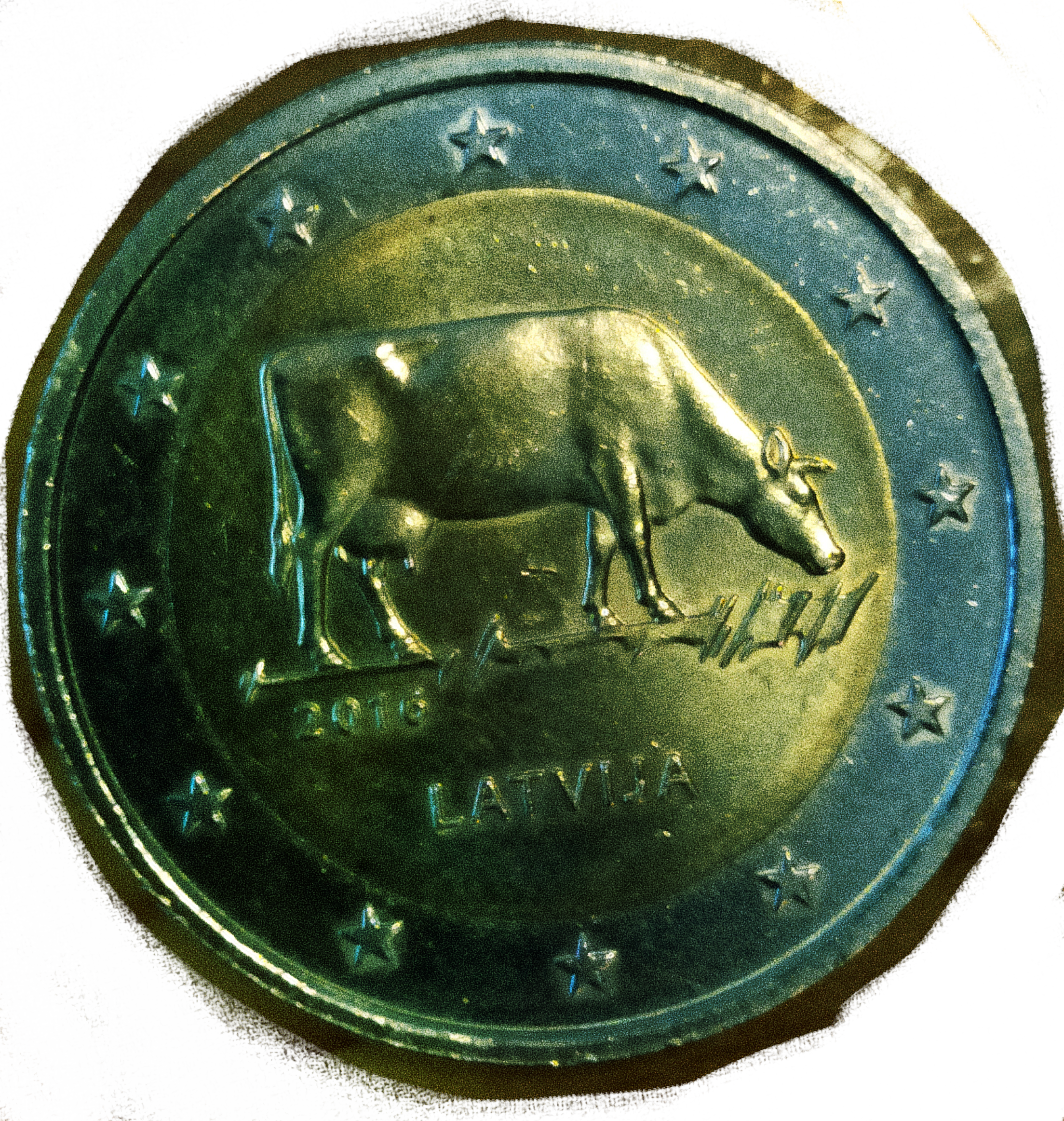 a two euro coin with an image of a cow